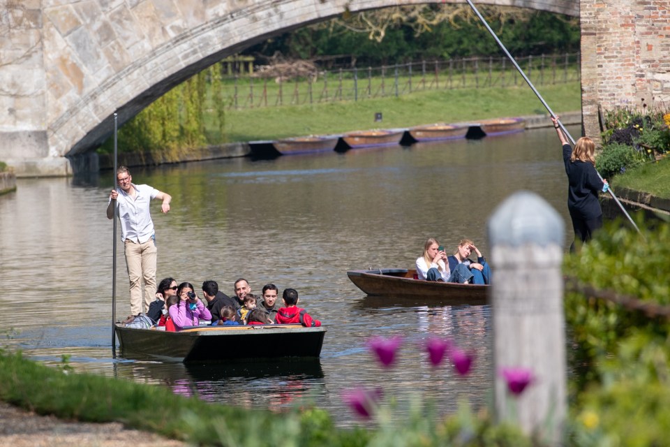 People out punting on the River Cam in Cambridge on a sunny Tuesday morning with the warm spring weather set to continue later this week