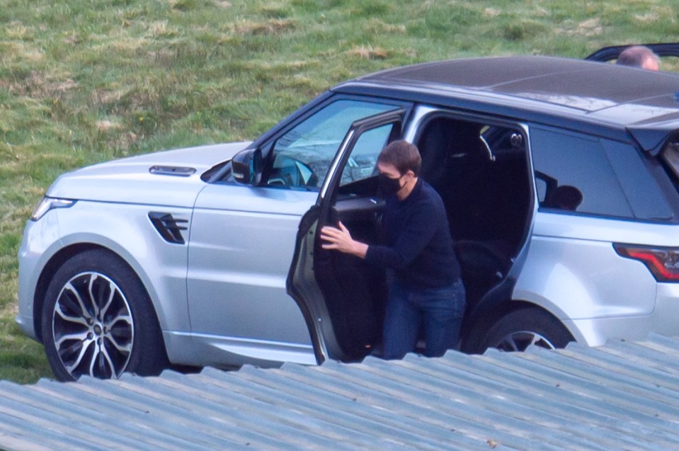 Filming done, Tom got into a waiting Range Rover before disappearing in a helicopter