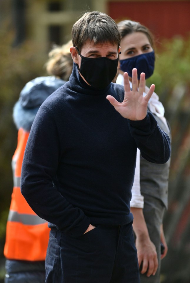 Tom was later seen waving to fans in a face mask before getting in a helicopter