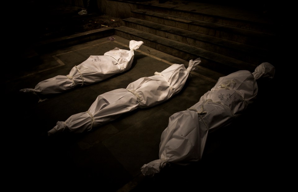 Dead bodies of patients who died of Covid-19 are wrapped in protective covers