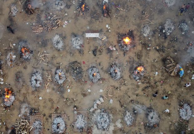 A mass cremation of victims who died due to coronavirus in New Delhi, India