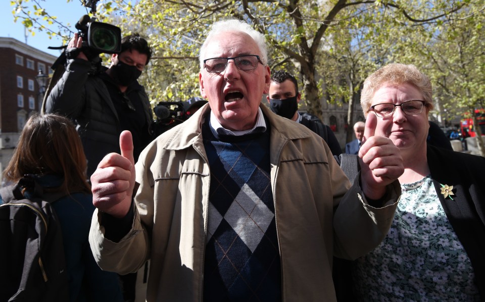 Former post office worker Noel Thomas, who was convicted of false accounting in 2006, celebrates with his daughter Sian outside the Royal Courts of Justice in London