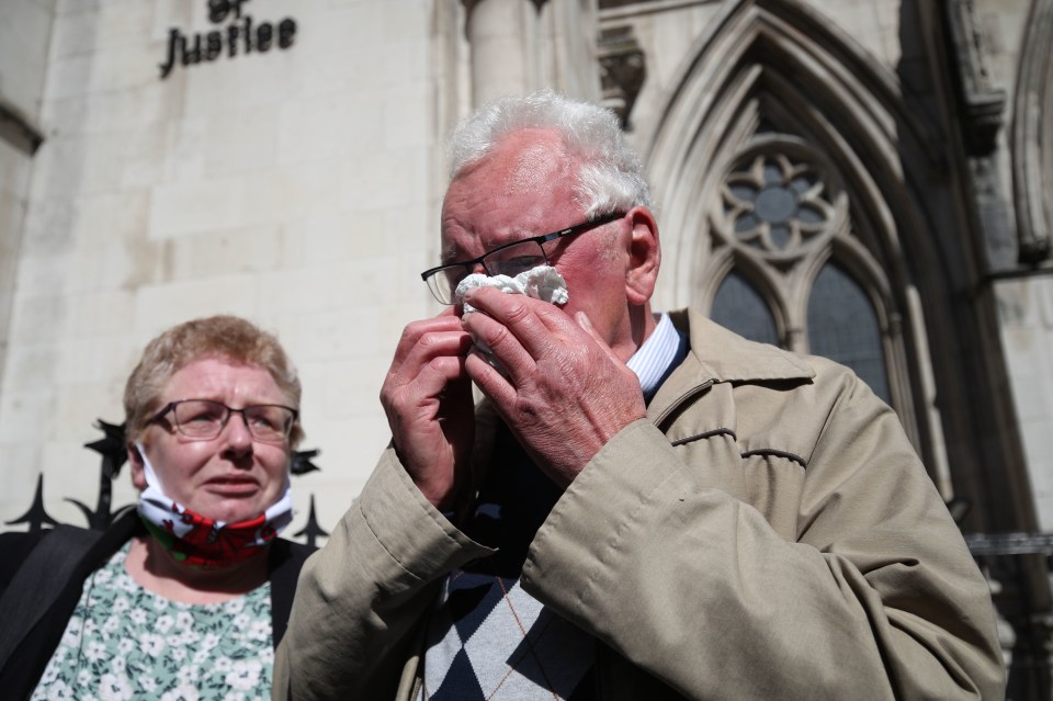 Former post office worker Noel Thomas, who was convicted of false accounting in 2006, weeps with his daughter Sian after having his conviction overturned by the Court of Appeal