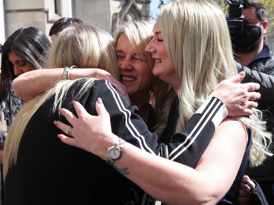 Former post office worker Janet Skinner (centre), with her niece Hayley Adams (right) and her daughter Toni Sisson, celebrating outside the Royal Courts of Justice