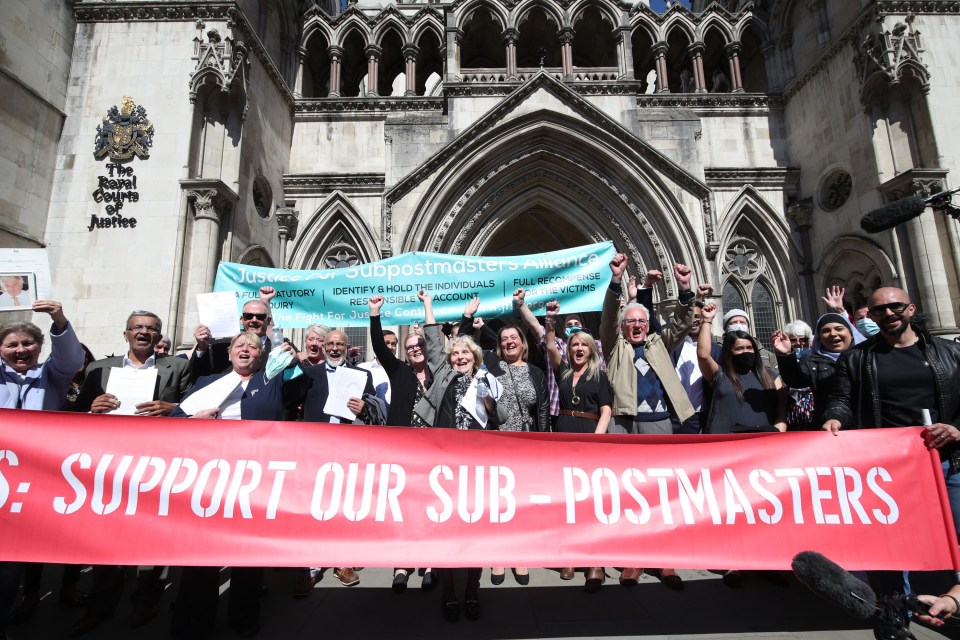 Former post office workers celebrate outside the Royal Courts of Justice, London, after having their convictions overturned by the Court of Appeal