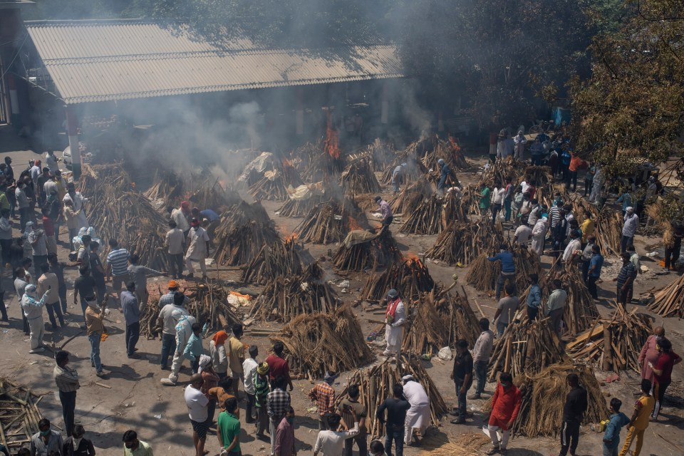 Multiple funeral pyres being lit