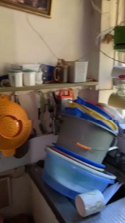 Piles of washing up in the kitchen