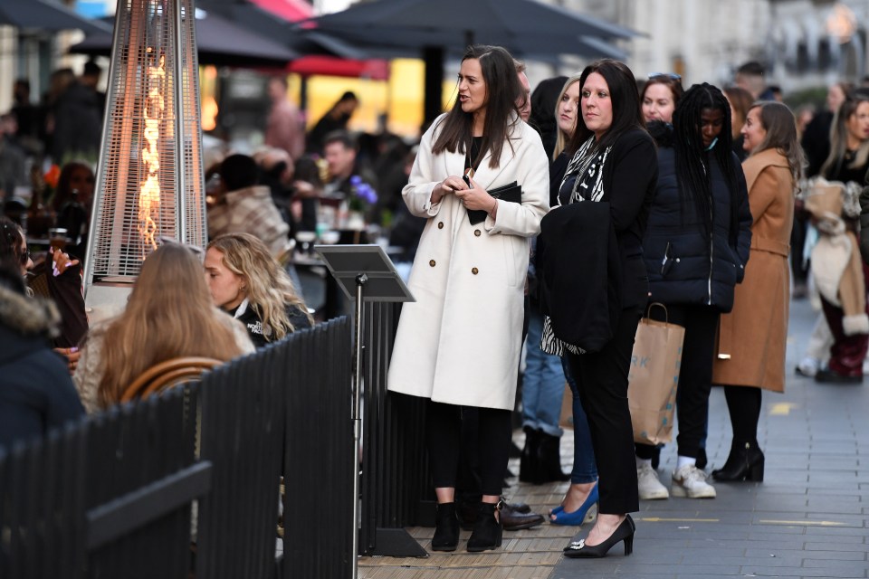 People venture out for a drink outdoors in Cardiff, after lockdown restrictions were eased