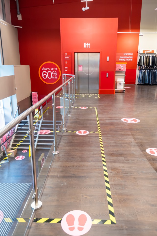 Markers have been placed on the floor to remind shoppers to social distance