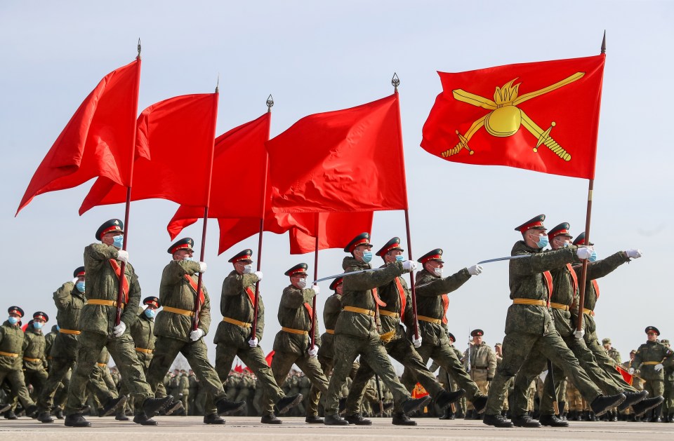 Servicemen march in formation during a military training exercise ahead of a victory parade in Russia