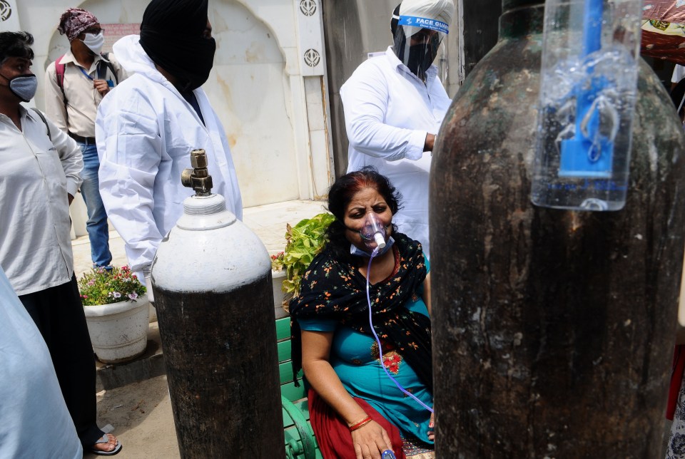 One patient receives oxygen on the street as the nearest hospital is full