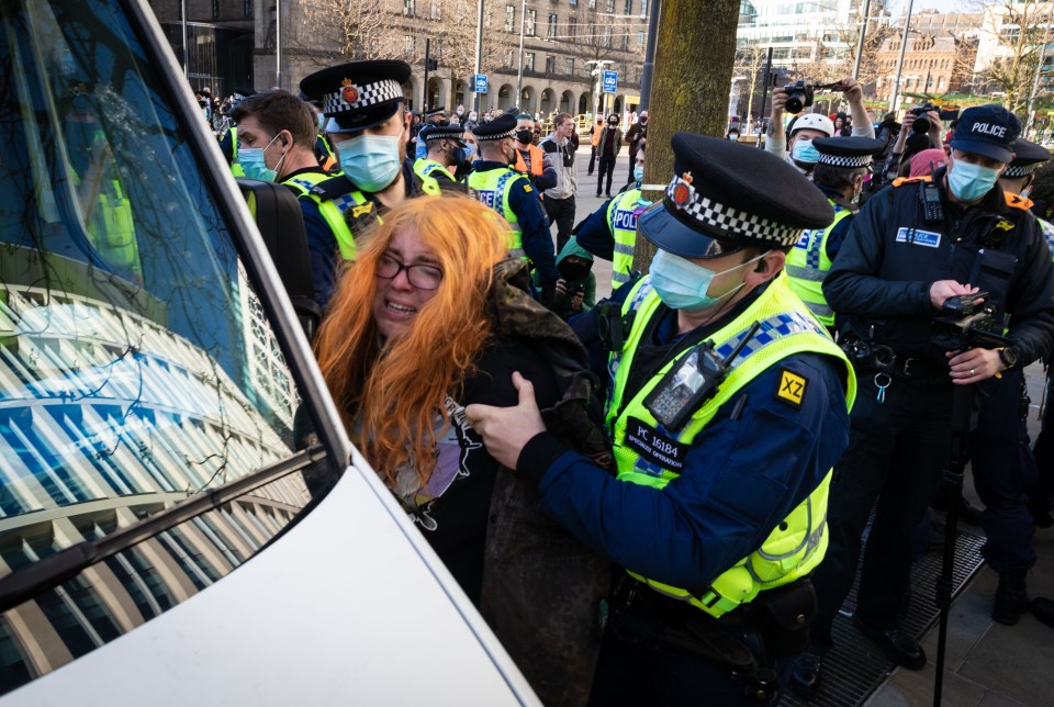 This protester was detained by police during the demonstration in Manchester