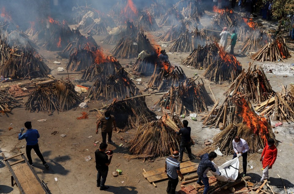 Mass funeral pyres being lit near Delhi, which has been badly hit