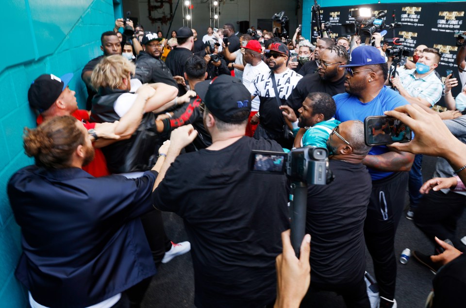 Logan Paul, dressed in the black jacket on the left, was involved in the ugly scenes