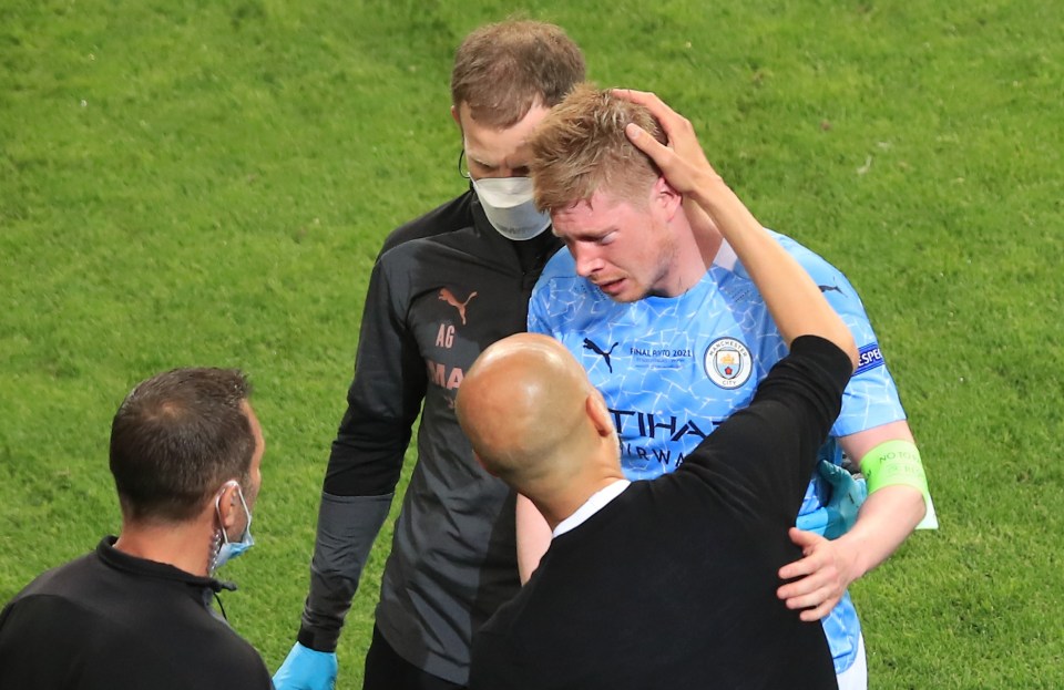 Man City boss Pep Guardiola tries to console injury victim Kevin De Bruyne