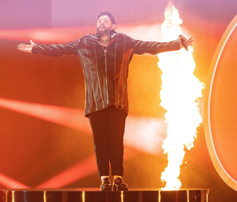 James has decided the flames are a little too close for comfort to wear his flammable-looking shiny gold trousers