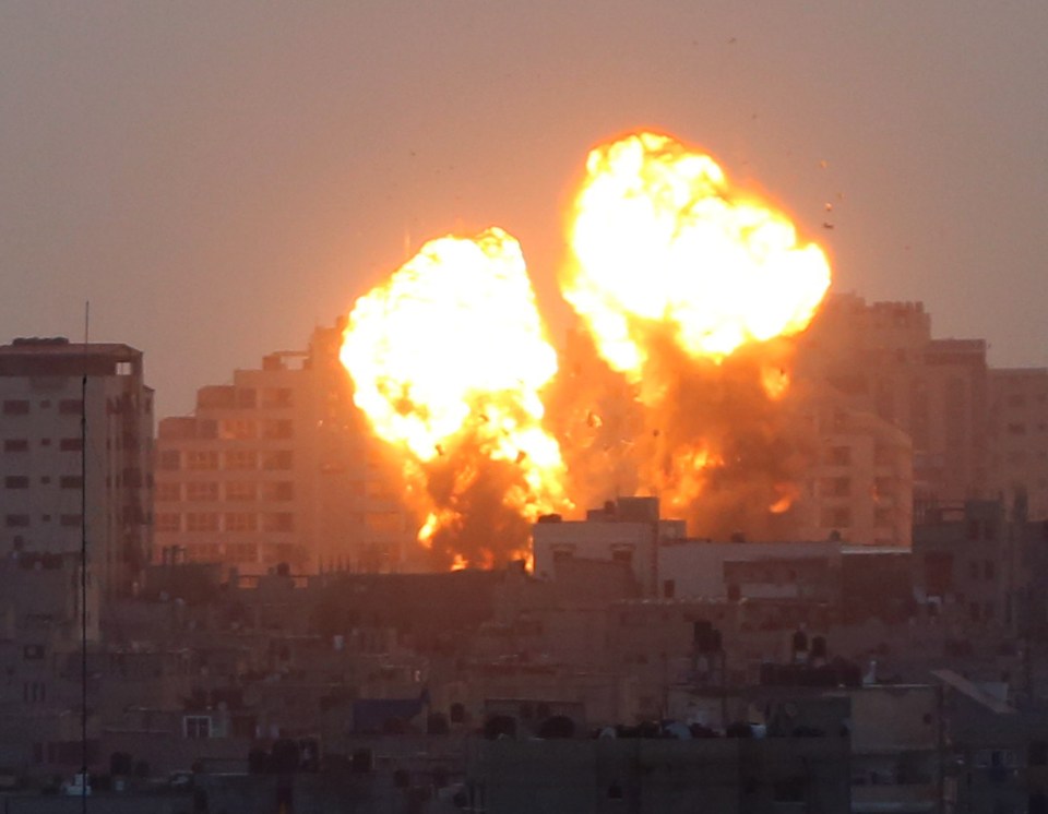 Flames erupting after an Israeli warplane hit Gaza