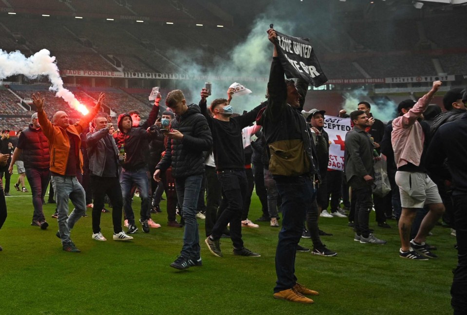 Fans waved flares on the United pitch