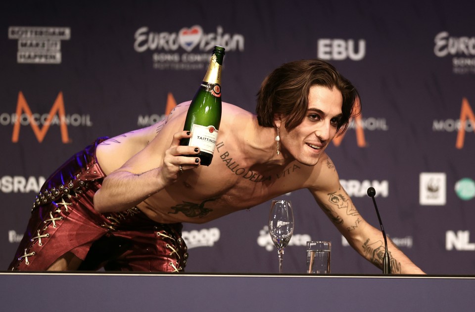 They were seen downing champagne at the press conference