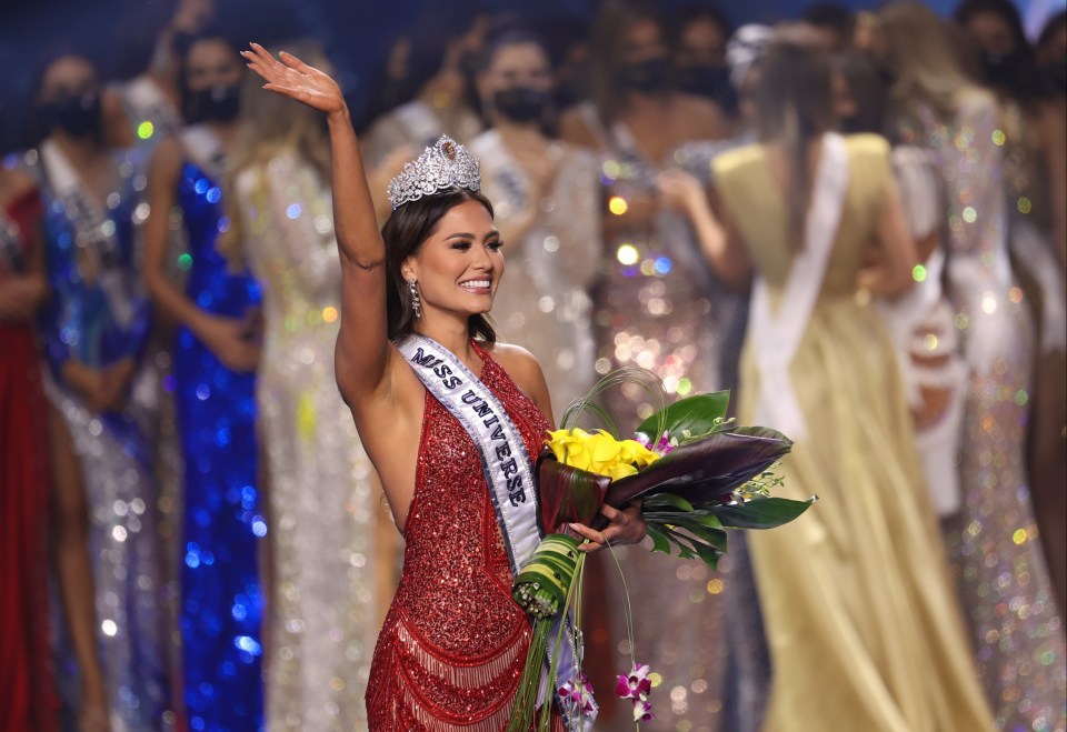 Andrea Meza, a model and software engineer, wore a dazzling red gown as she accepted the award