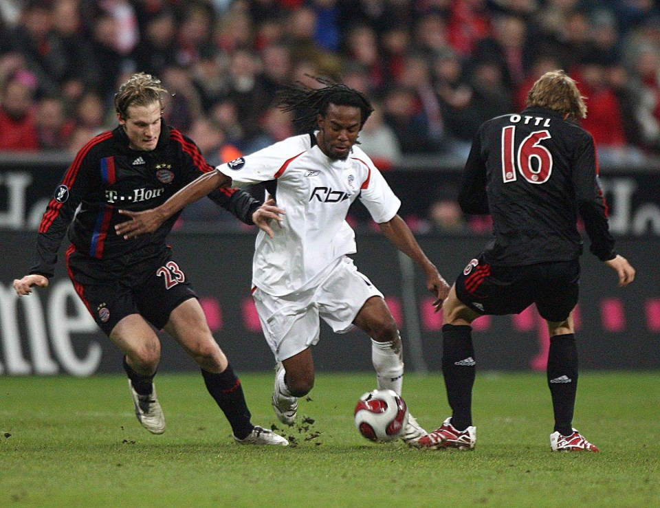 Bolton star Ricardo Gardner takes on two Bayern Munich players in the Allianz Arena