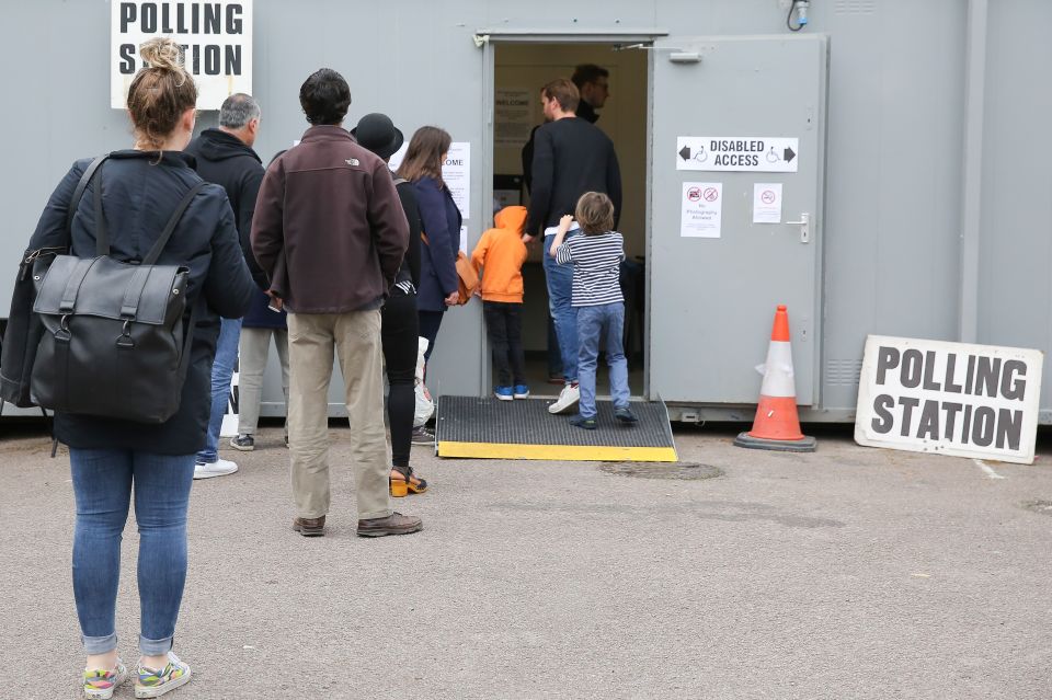 People queue to cast their vote