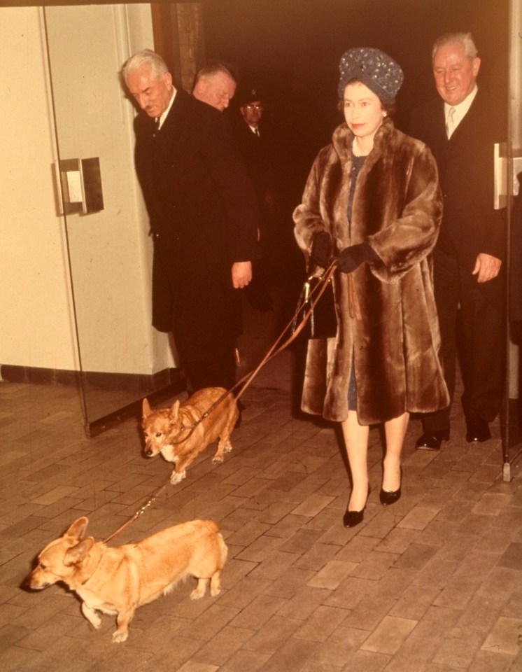 The Queen at Liverpool Street Station with two of her pet corgis