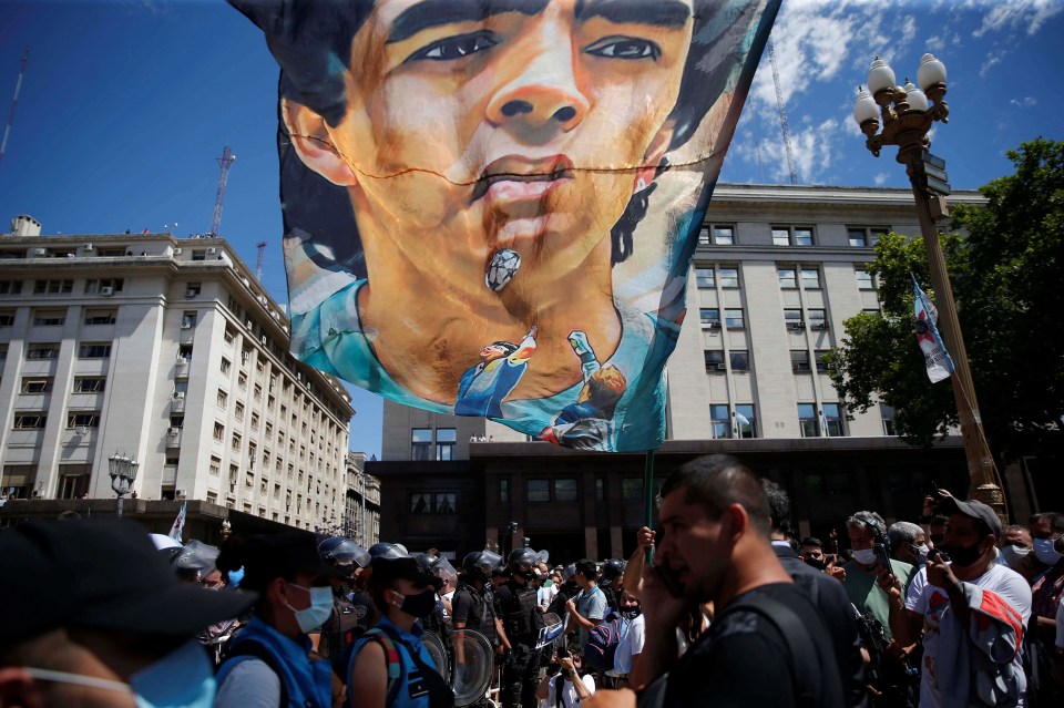 Fans of soccer legend Maradona gather in front of the funeral chapel