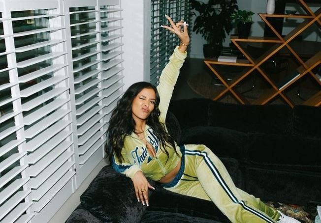 Maya posing in her green tracksuit after reportedly flying to see Ben in the US