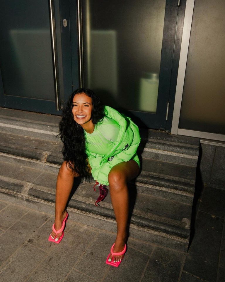 Maya beamed for the camera in a matching lime jacket  from from Trapstar London and pink flip-flops