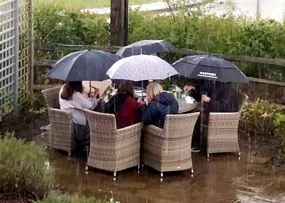 Around the country, pubs have been raking in much-needed cash from punters desperate for a pint - even, in the case of these girls in Exeter, when the weather wasn't on their side