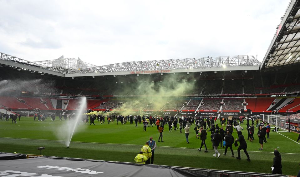 Furious fans broke onto the Old Trafford pitch