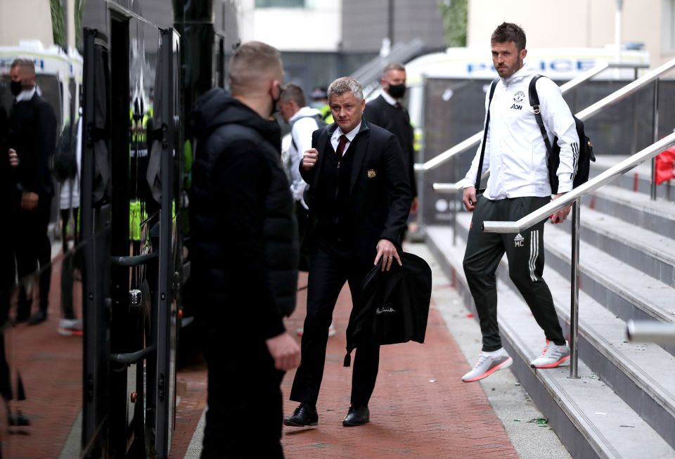 Manager Ole Gunnar Solskjaer and assistant Michael Carrick board the bus