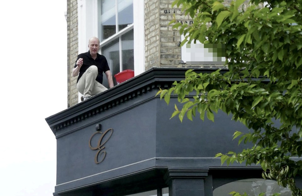 The TV star was cleaning his window at the time