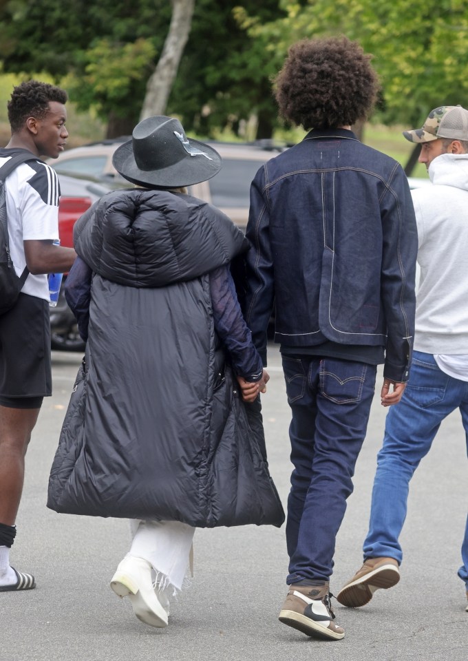 Madge teamed her denim outfit with a long puffer coat