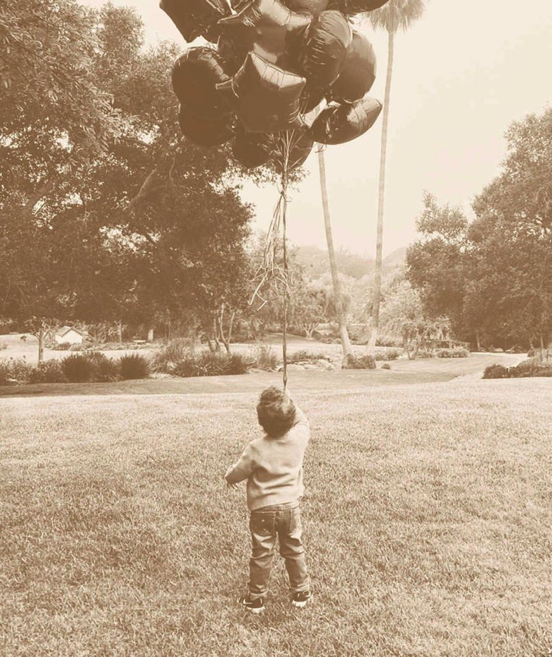 Harry and Meg shared a new picture of Archie holding balloons to mark his 2nd birthday on their Archewell website