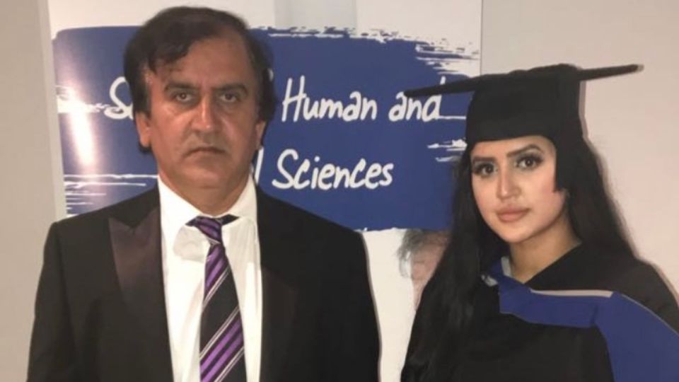 The victim pictured with her father on her graduation