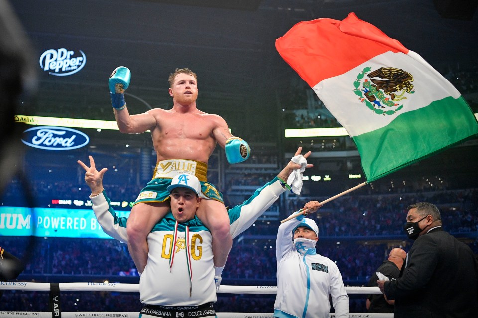 The four-weight king was paraded around the ring as the Mexican flag was waved