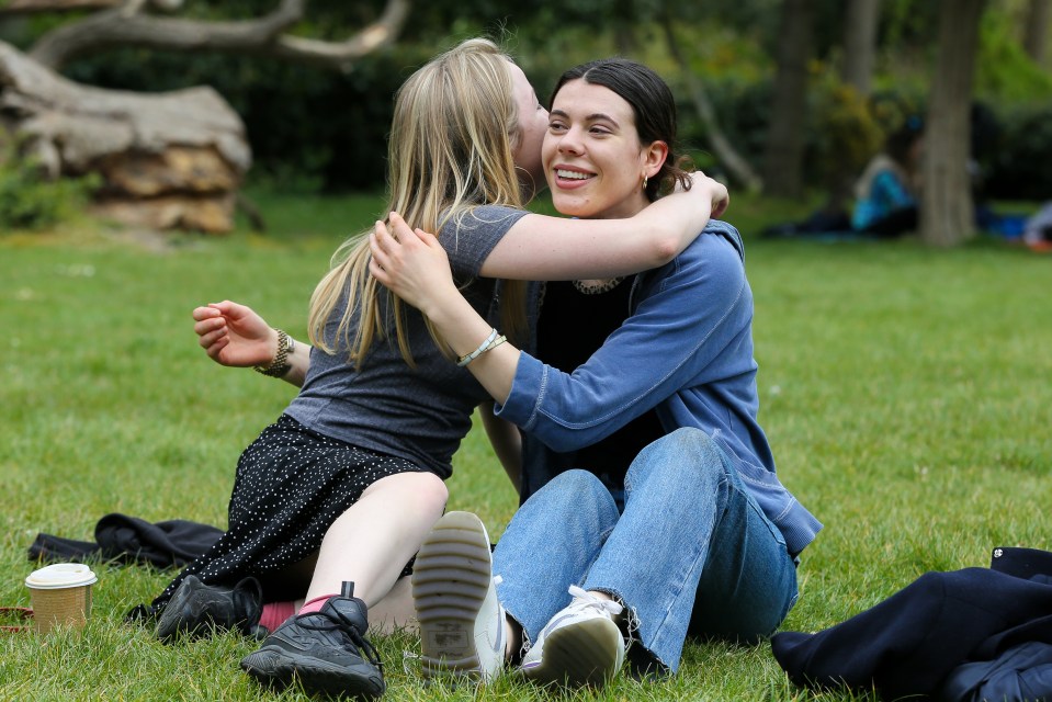 UK Covid cases are on the rise, data suggests, ahead of the next stage of unlocking. Pictured, two friends in Finsbury Park, north London, 10 May