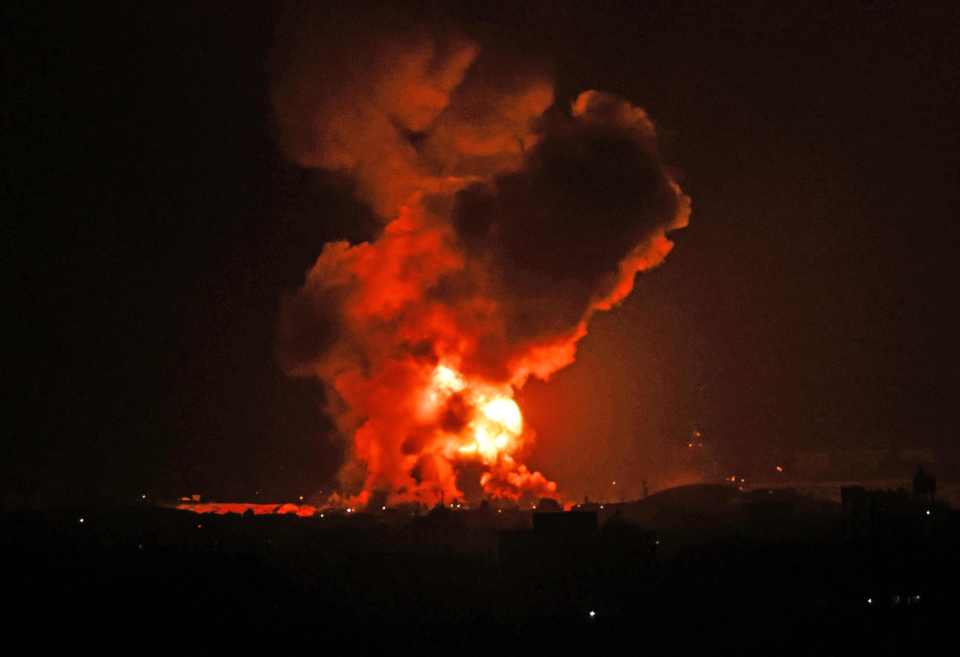 A fire rages following an Israeli air strike overnight on the southern Gaza region of Khan Yunis