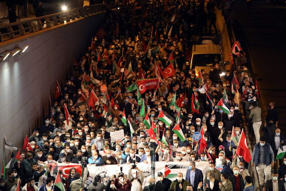 People demonstrate outside the Israel Consulate in Istanbul against Israel's deadly air strikes launched on Gaza