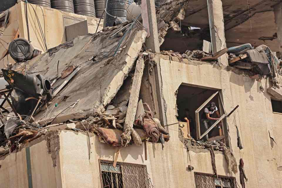 The rooftop of a building is seen destroyed following an Israeli airstrike at al-Shati Refugee Camp in Gaza City