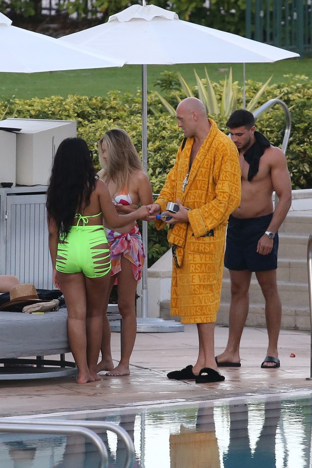 Tommy Fury was stood behind Tyson as he chatted with female fans