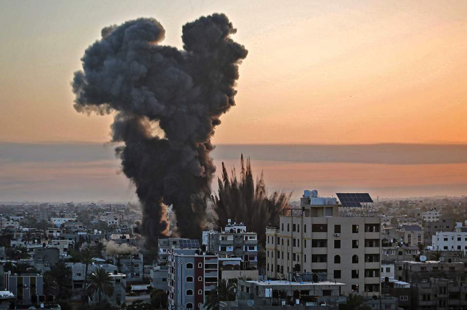 Black smoke billows after a series of Israeli airstrikes on Wednesday morning