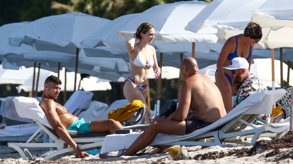 Tyson Fury does his best to avoid female attention on the beach with his brother Tommy