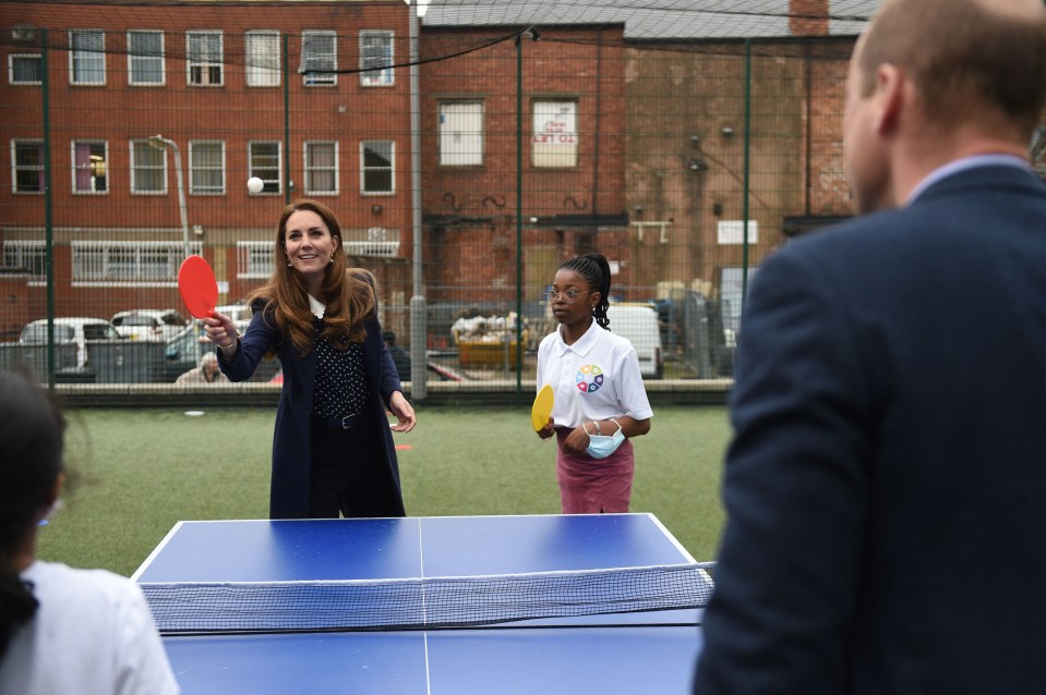 Smiling Kate played a game of ping pong with three kids from the centre