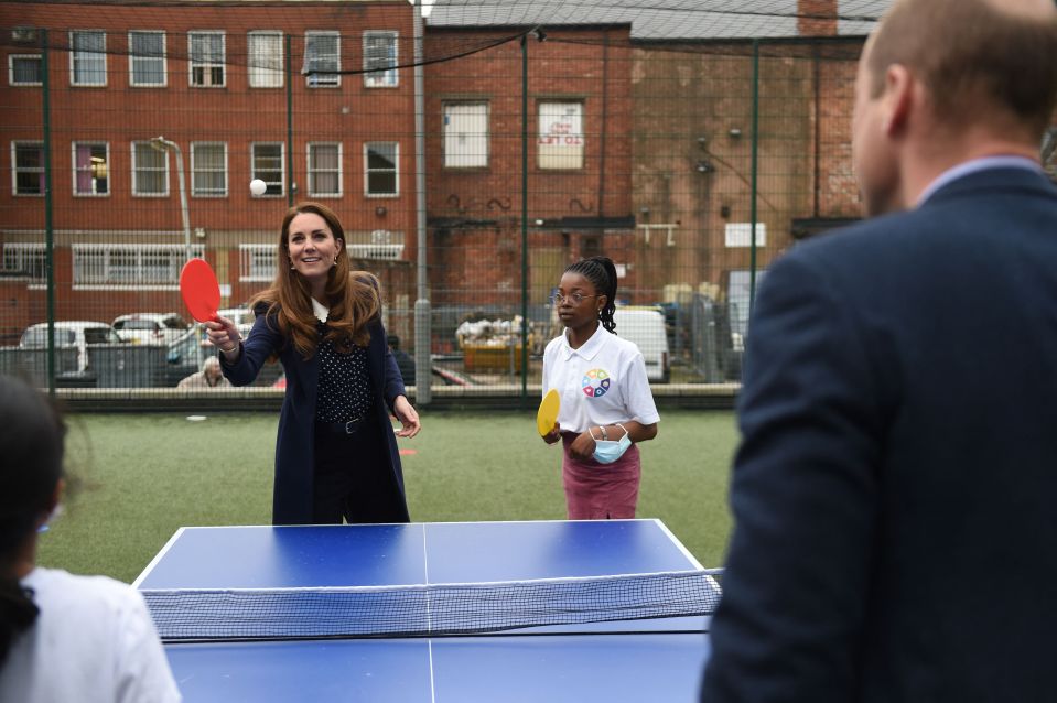 Smiling Kate played a game of ping pong with three kids in Wolverhampton