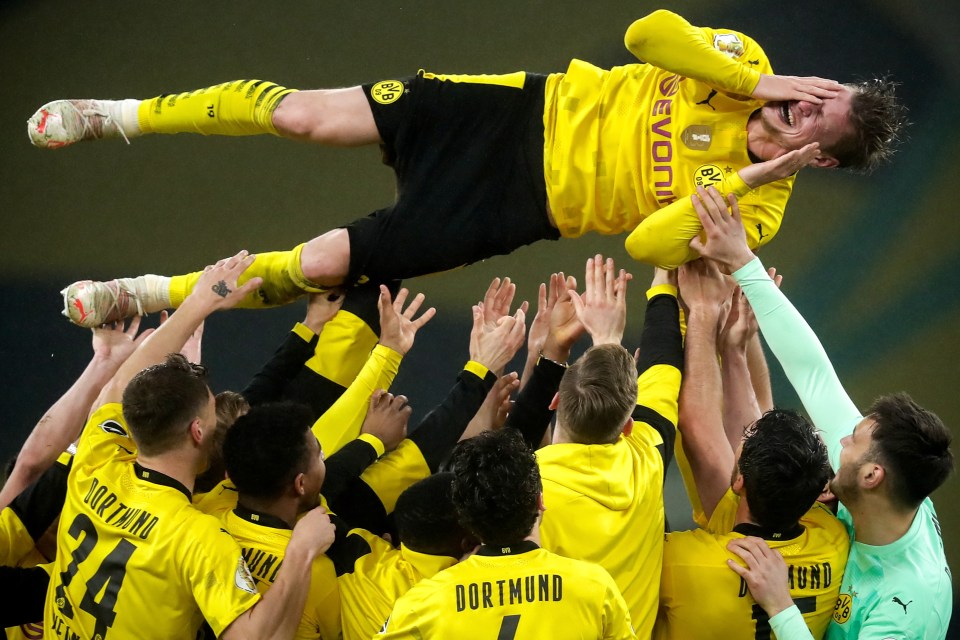 Lukasz Piszczek was hoisted in the air ahead of his retirement this summer