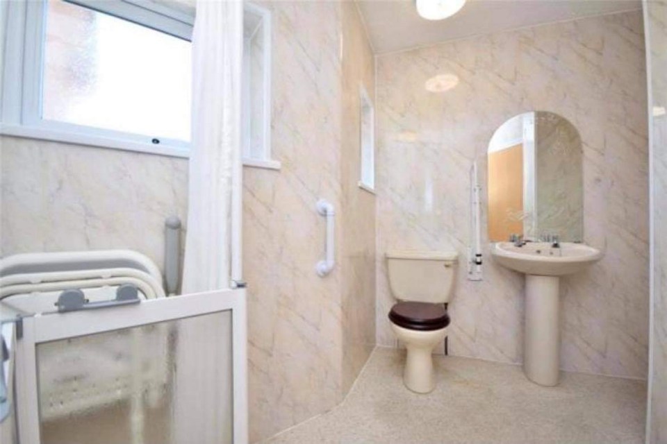 They didn't like the bathroom's awkward layout so planned an entire new remodel