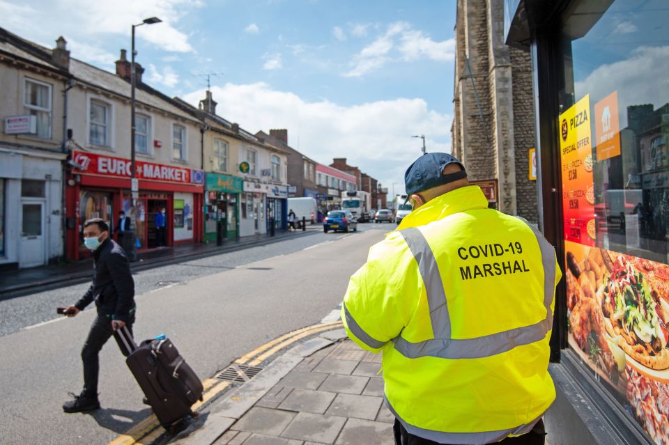 A Covid marshal on patrol in Bedford